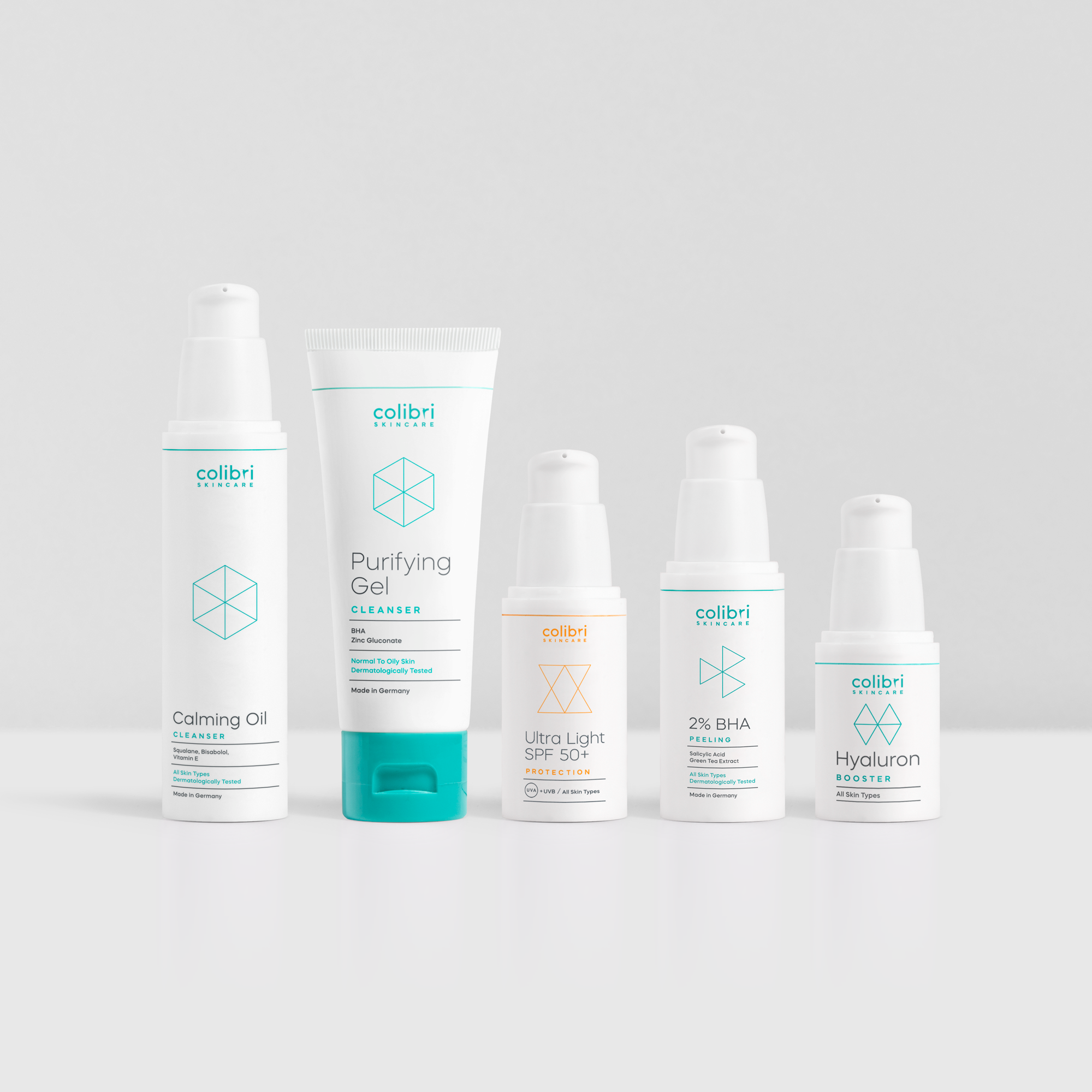 Fünf Colibri Skincare-Produkte nebeneinander, darunter Reinigungsöle, Peelings und Sonnenschutzmittel, auf weißem Hintergrund.