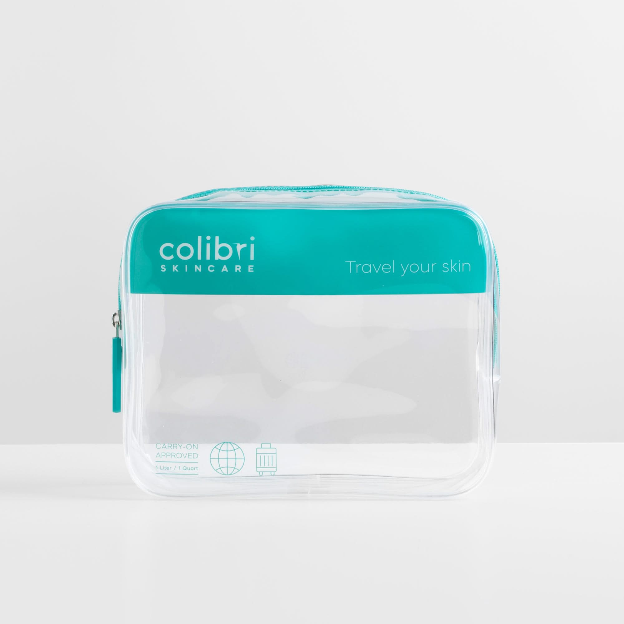 Transparente Reisekosmetiktasche mit türkisfarbenem Reißverschluss und Branding "colibri skincare".